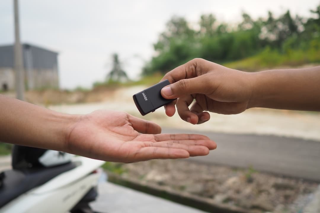 person holding black rectangular device — Photo by angga on Unsplash