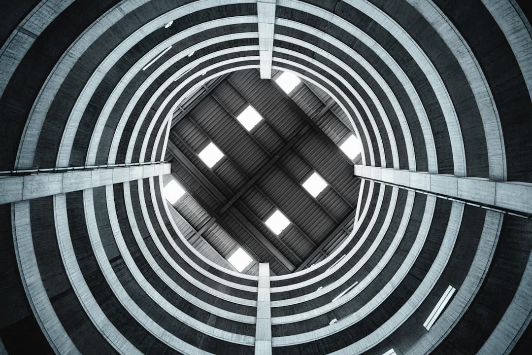 a view of the inside of a building looking up at the ceiling — Photo by Rico Reutimann on Unsplash