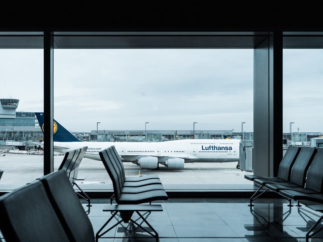 empty gray airport seats during daytime — Photo by Dennis Gecaj on Unsplash